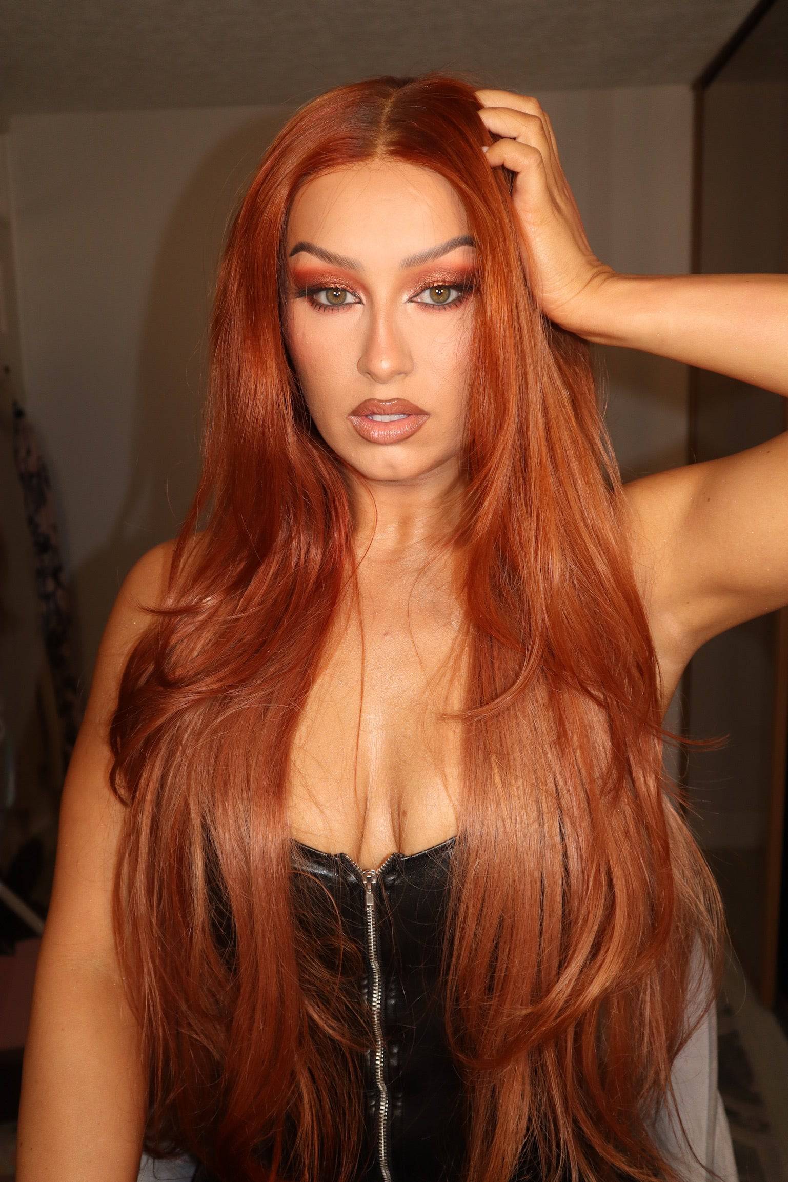 Model showcasing an Auburn hair wig with a natural hairline and body wave texture.