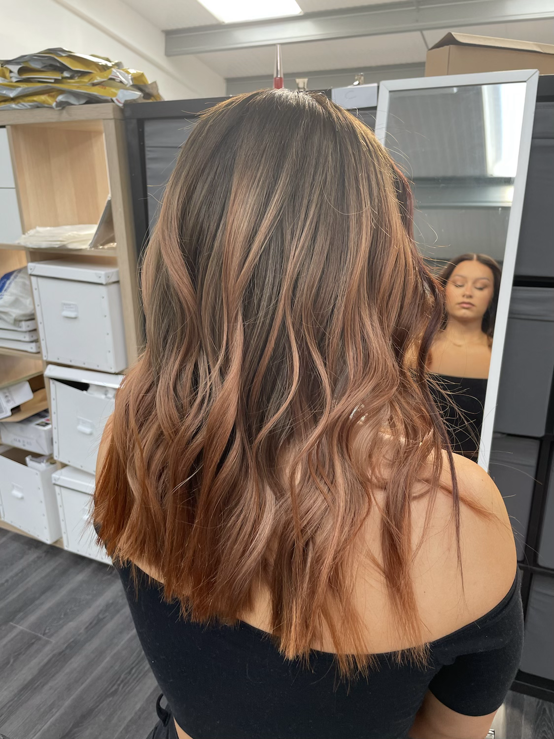 Model wearing auburn 16-inch HD lace human hair wig in body wave texture – Nuola Wigs.