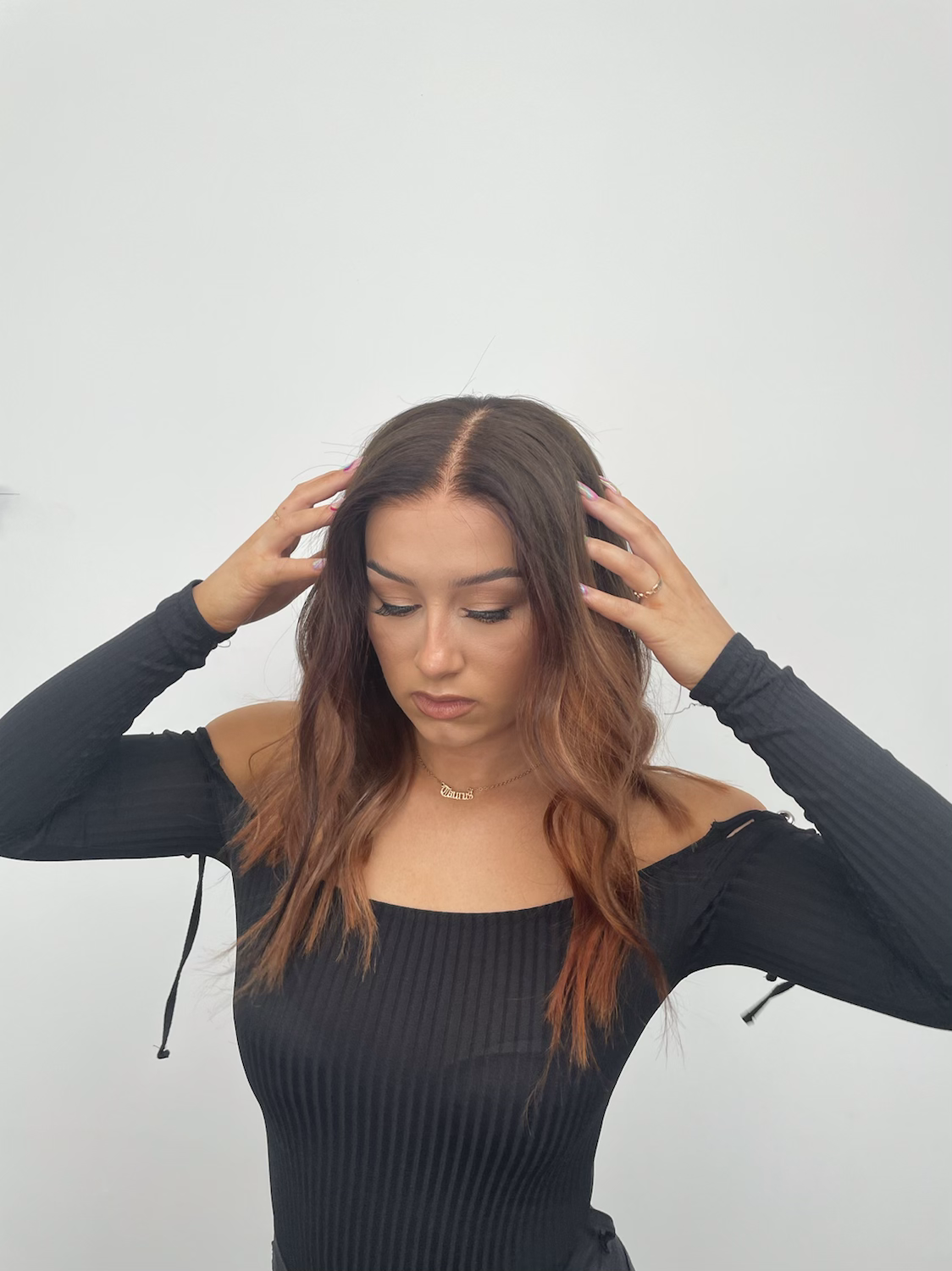 Model wearing auburn 16-inch HD lace human hair wig in body wave texture – Nuola Wigs.