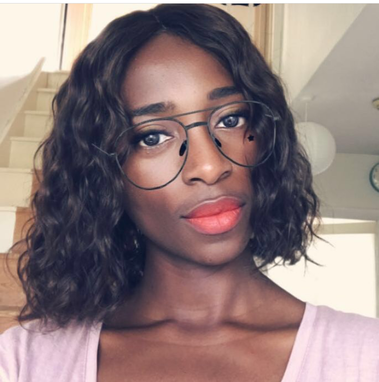 Model wearing black 10-inch HD lace human hair wig in body wave texture – Nuola Wigs.