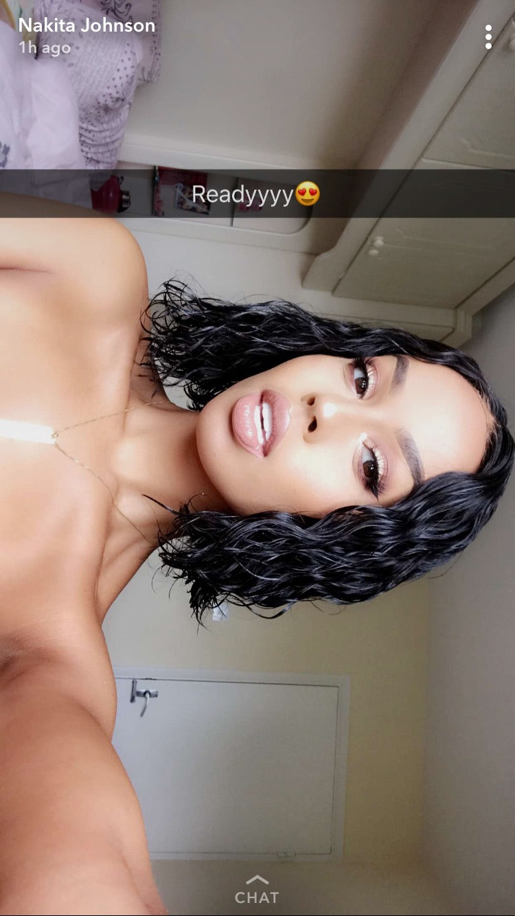 Model wearing black 10-inch HD lace human hair wig in body wave texture – Nuola Wigs.