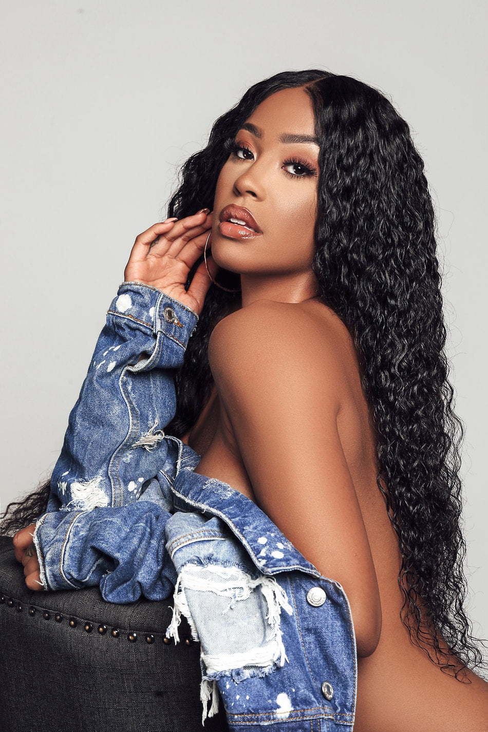 Model wearing black 24-inch HD lace human hair wig in body wave texture – Nuola Wigs.