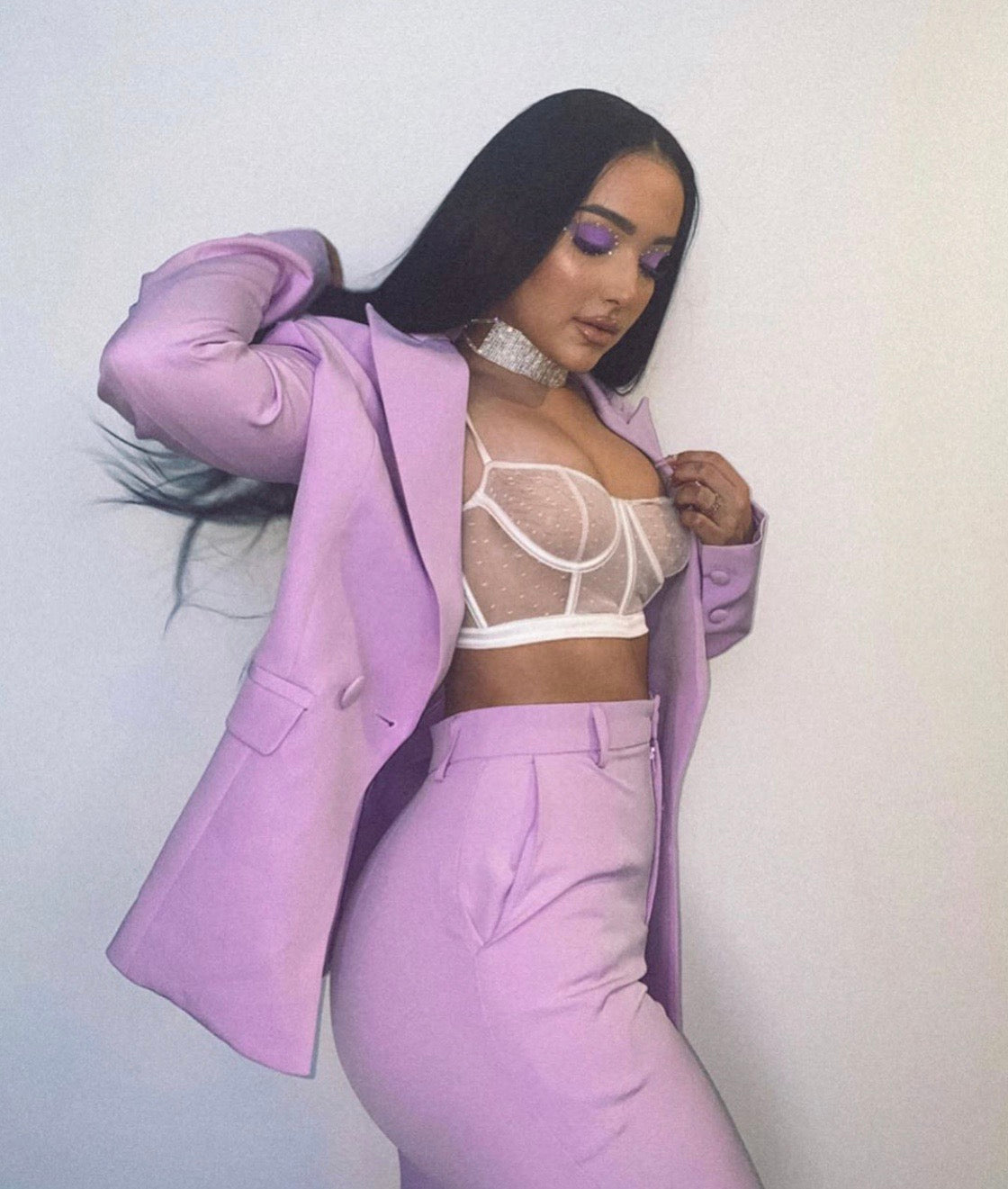 Model wearing black 28-inch HD lace human hair wig in body wave texture – Nuola Wigs.