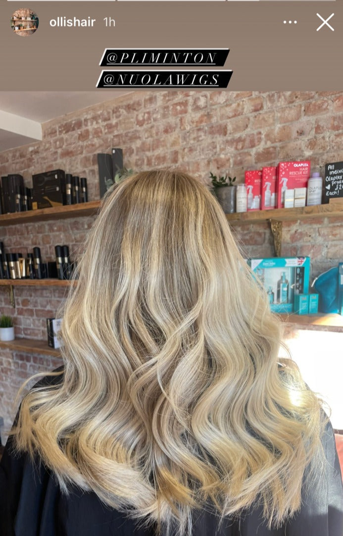 Model wearing blonde balayage 18-inch HD lace human hair wig in body wave texture – Nuola Wigs.