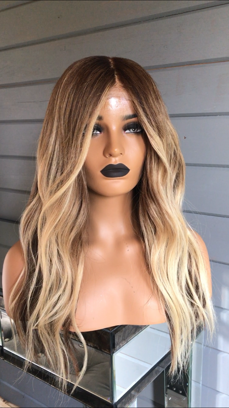 Model wearing blonde balayage 20-inch HD lace human hair wig in body wave texture – Nuola Wigs.