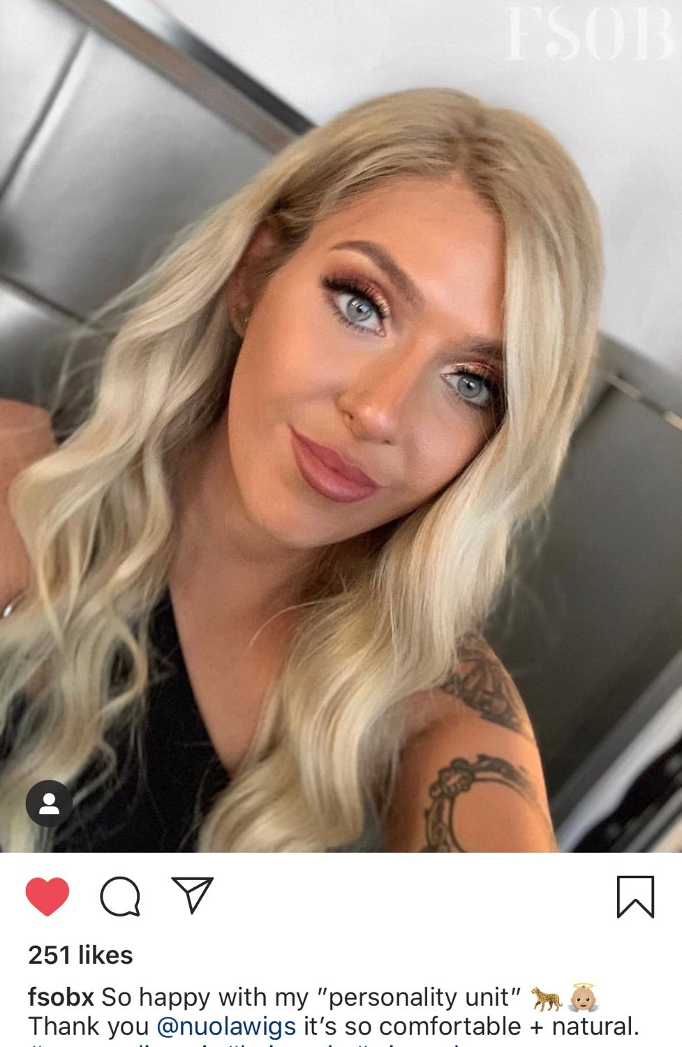 Model wearing blonde balayage 22-inch HD lace human hair wig in body wave texture – Nuola Wigs.