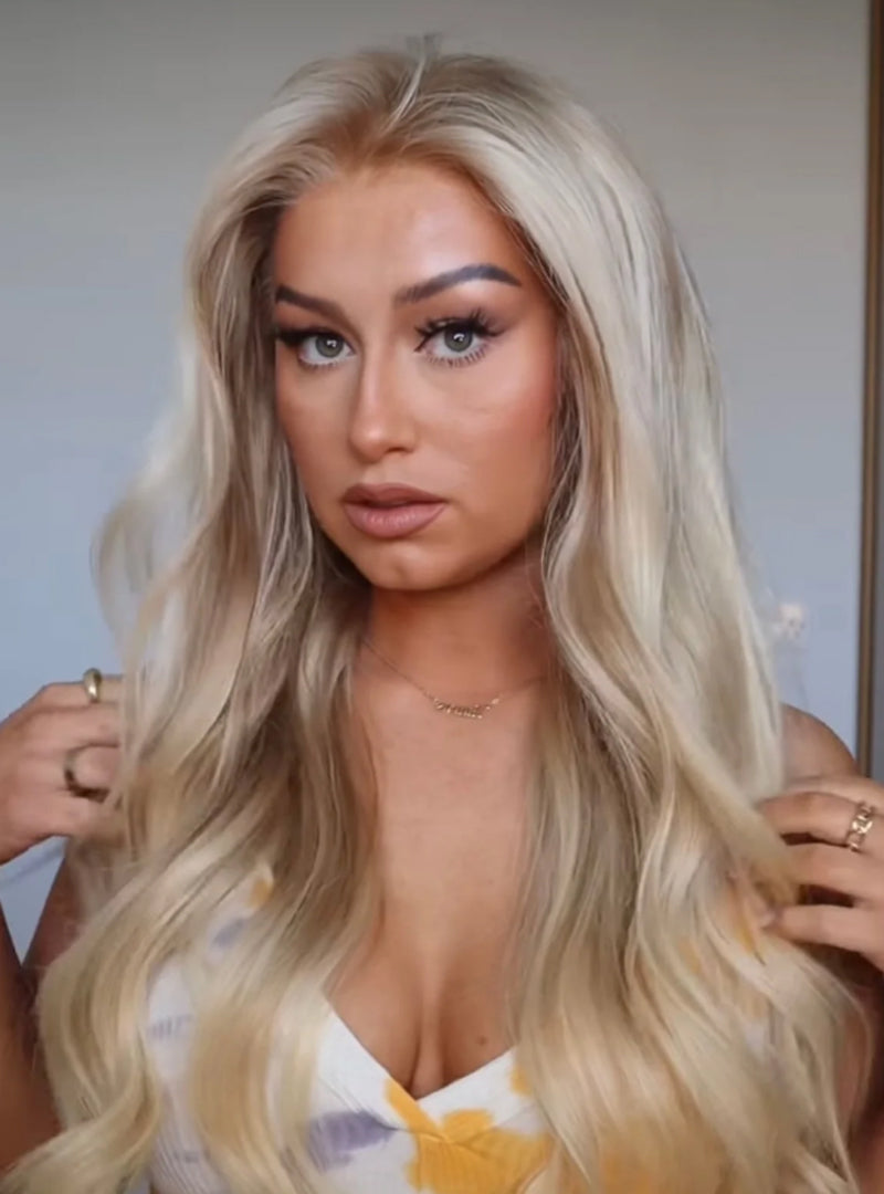 Model wearing blonde balayage 24-inch HD lace human hair wig in body wave texture – Nuola Wigs.