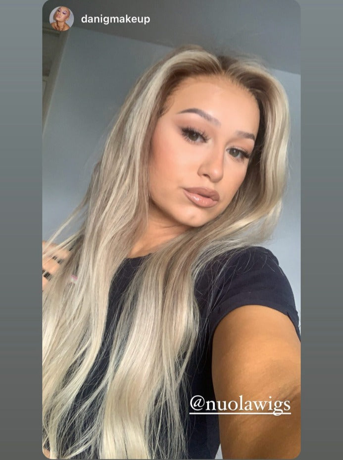 Model wearing blonde balayage 24-inch HD lace human hair wig in body wave texture – Nuola Wigs.