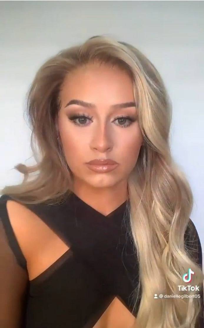 Model wearing blonde balayage 24-inch HD lace human hair wig in body wave texture – Nuola Wigs.