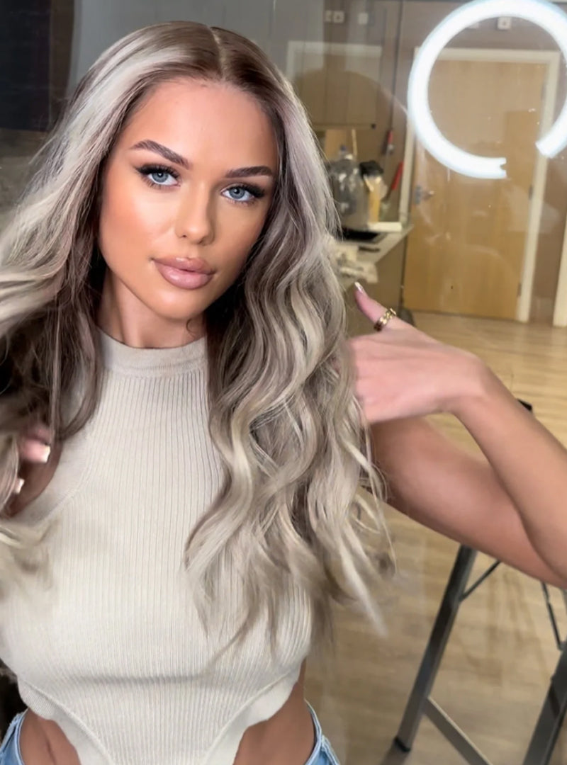 Model wearing blonde balayage 24-inch HD lace human hair wig in body wave texture – Nuola Wigs.