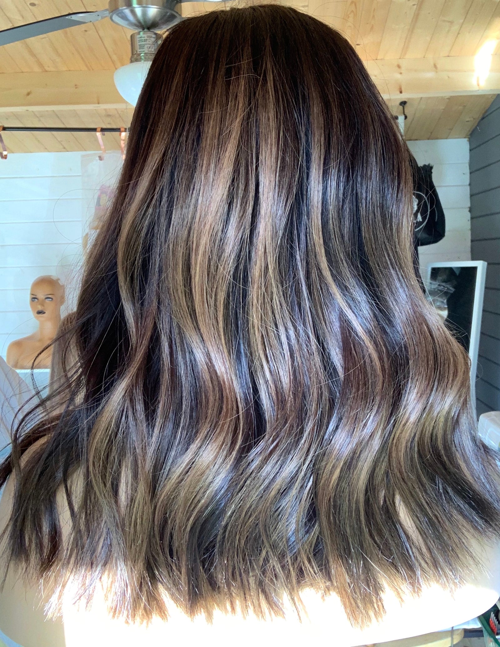 Model wearing brown balayage 15-inch HD lace human hair wig in body wave
texture – Nuola Wigs.