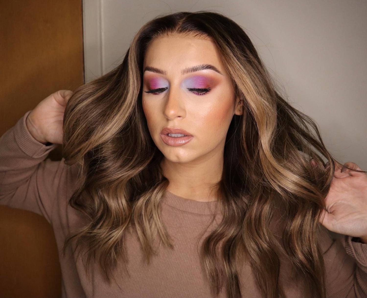 Model wearing brown balayage 20-inch HD lace human hair wig in body wave
texture – Nuola Wigs.