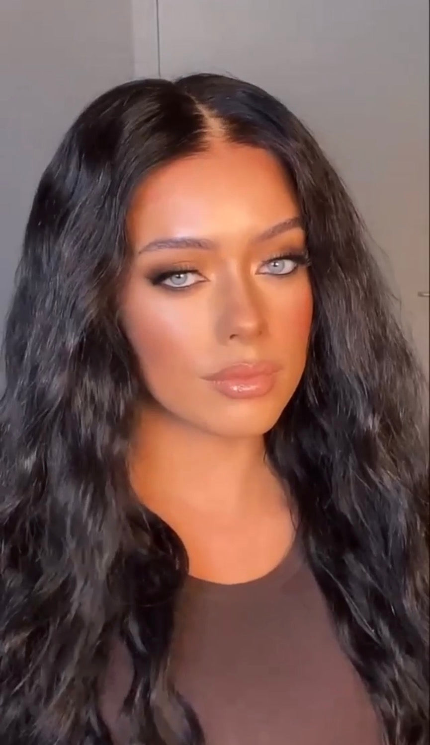 Model wearing brown balayage 20-inch HD lace human hair wig in body wave
texture – Nuola Wigs.