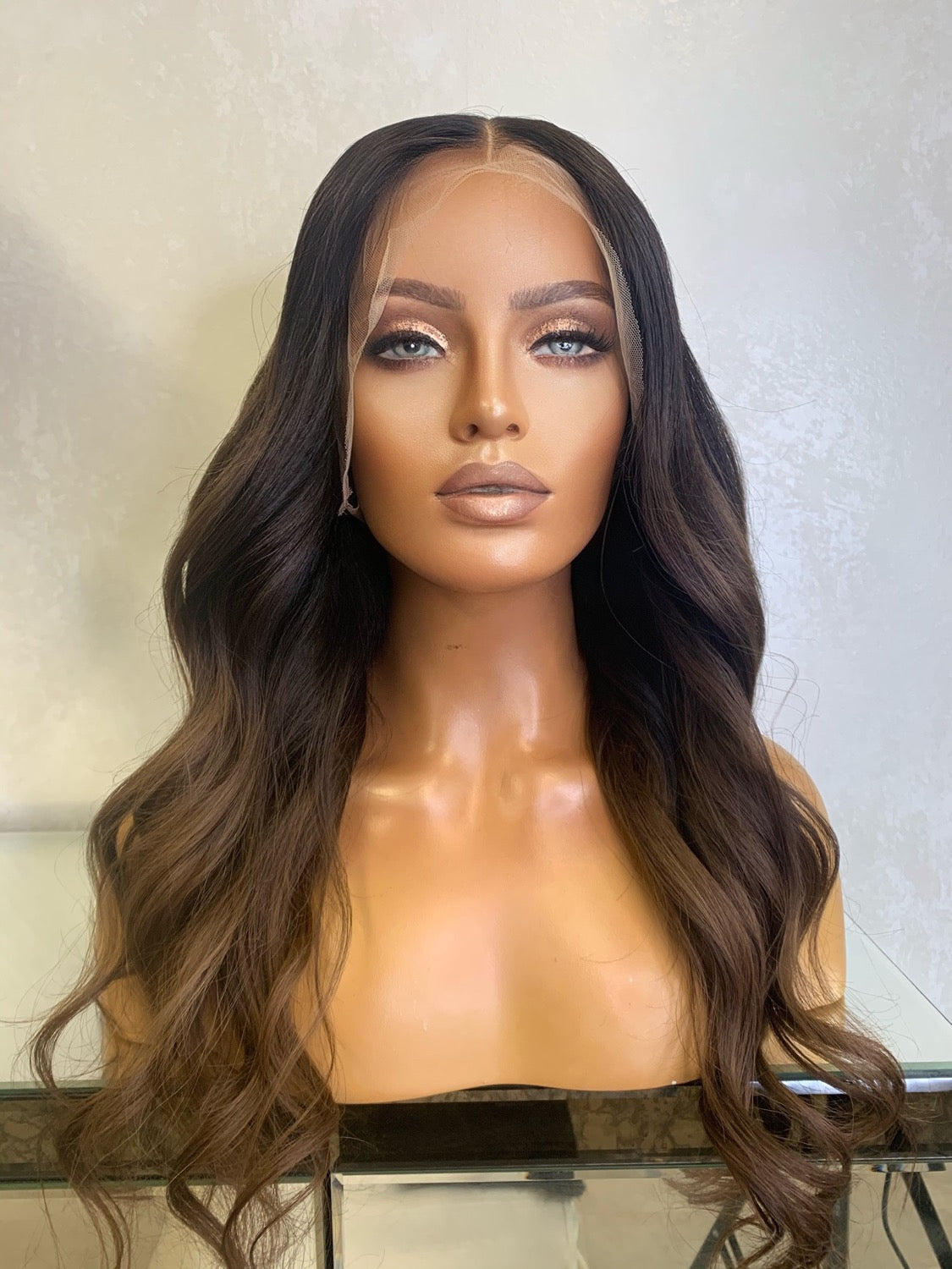 Model wearing brown balayage 20-inch HD lace human hair wig in body wave
texture – Nuola Wigs.