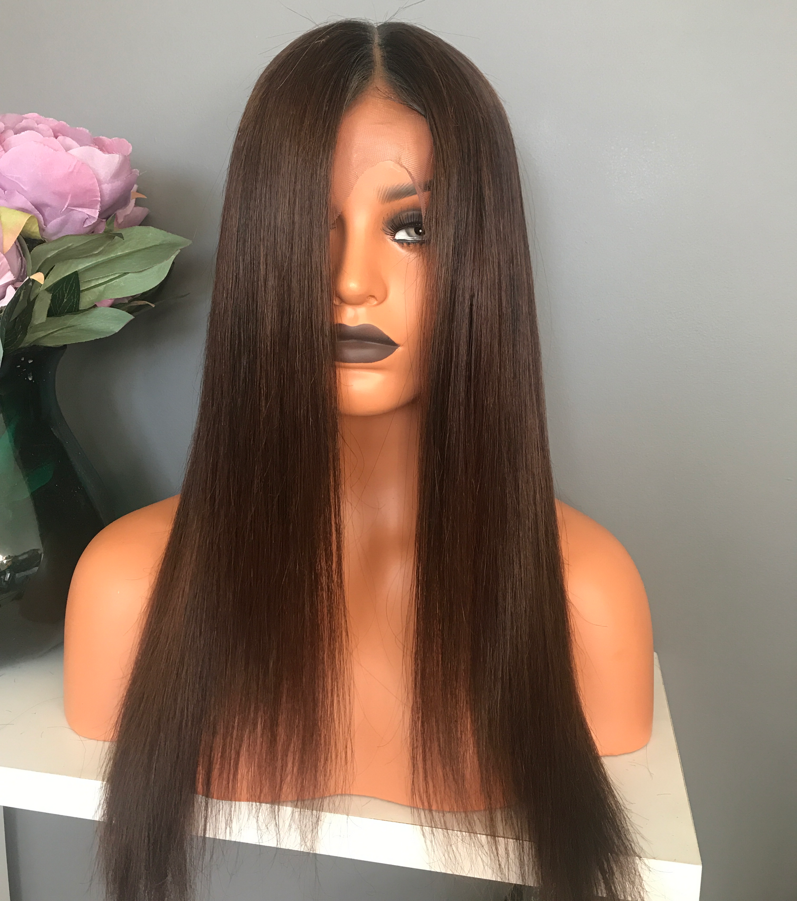 Model wearing brown balayage 20-inch HD lace human hair wig in body wave
texture – Nuola Wigs.