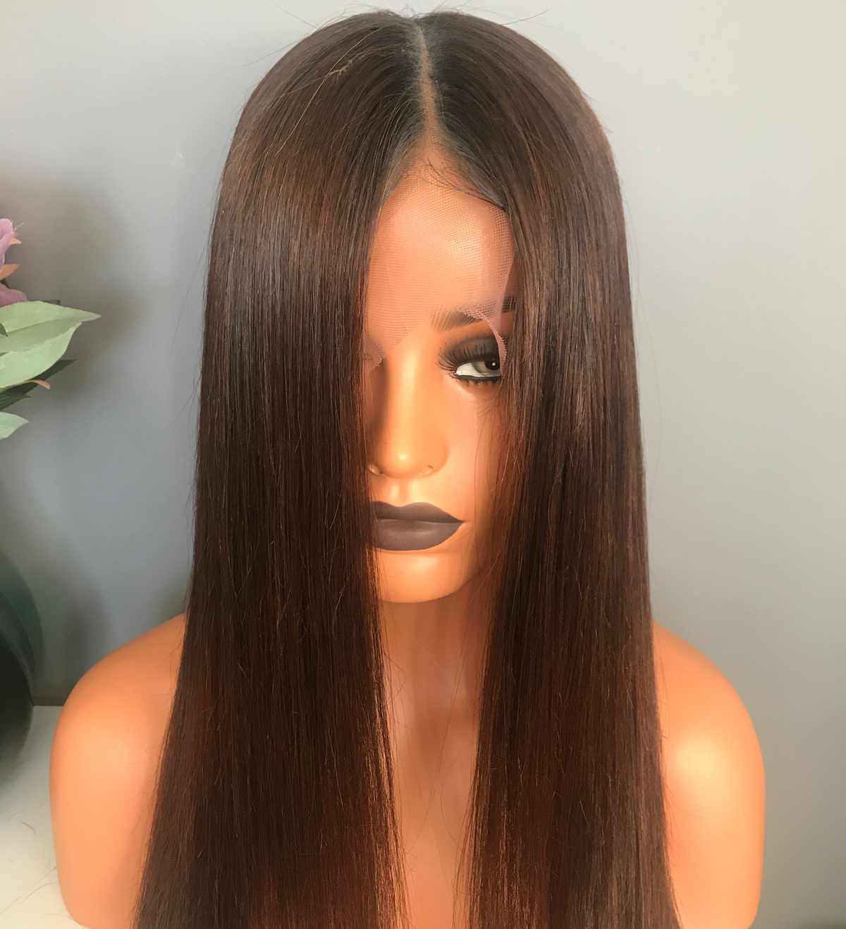 Model wearing brown balayage 20-inch HD lace human hair wig in body wave
texture – Nuola Wigs.