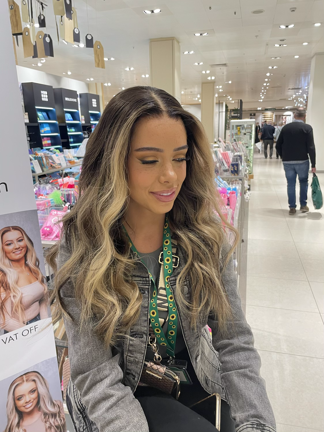 Model wearing brown balayage 22-inch HD lace human hair wig in body wave texture – Nuola Wigs.