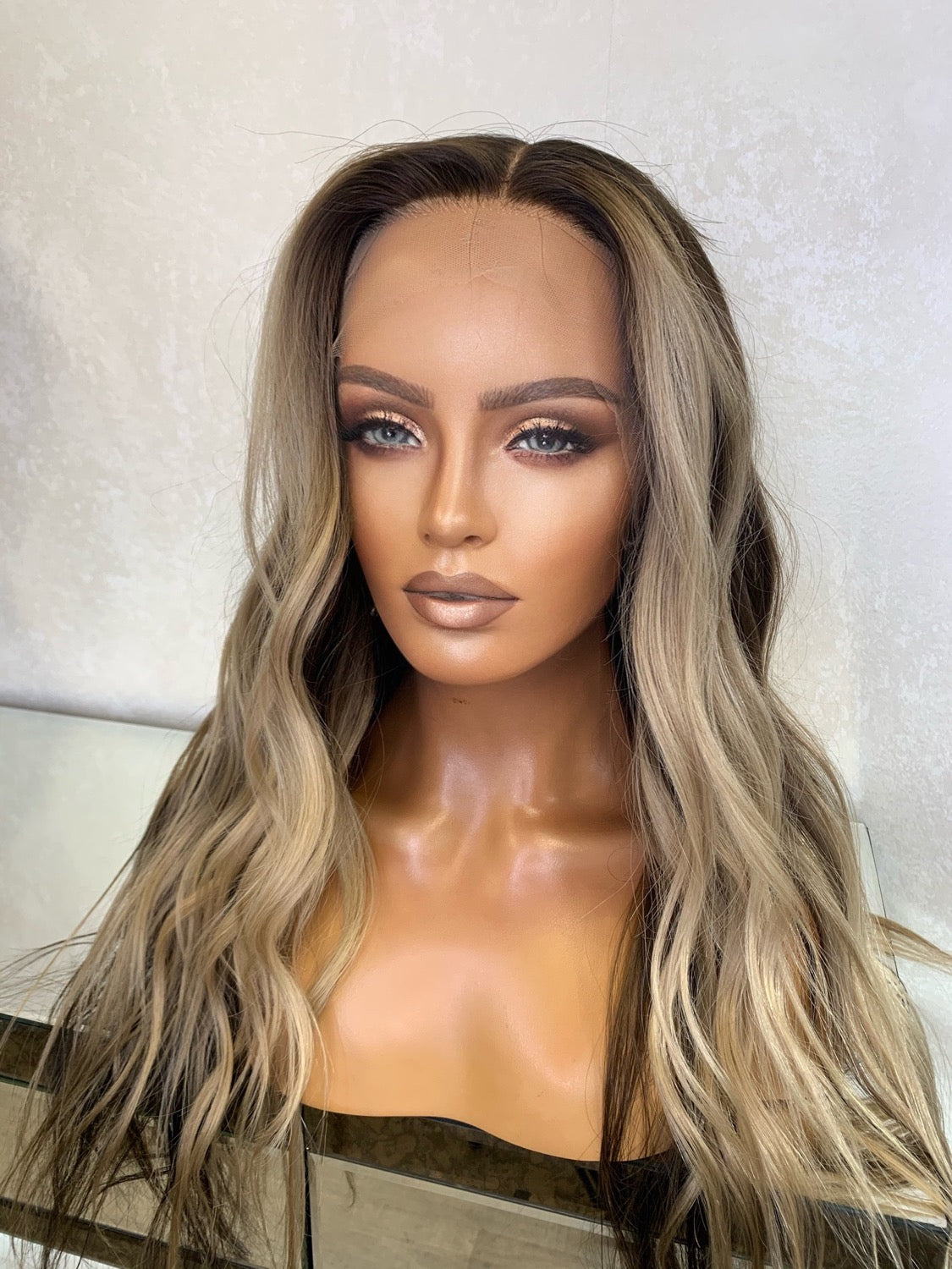 Sandy blonde body wave wig with soft curls