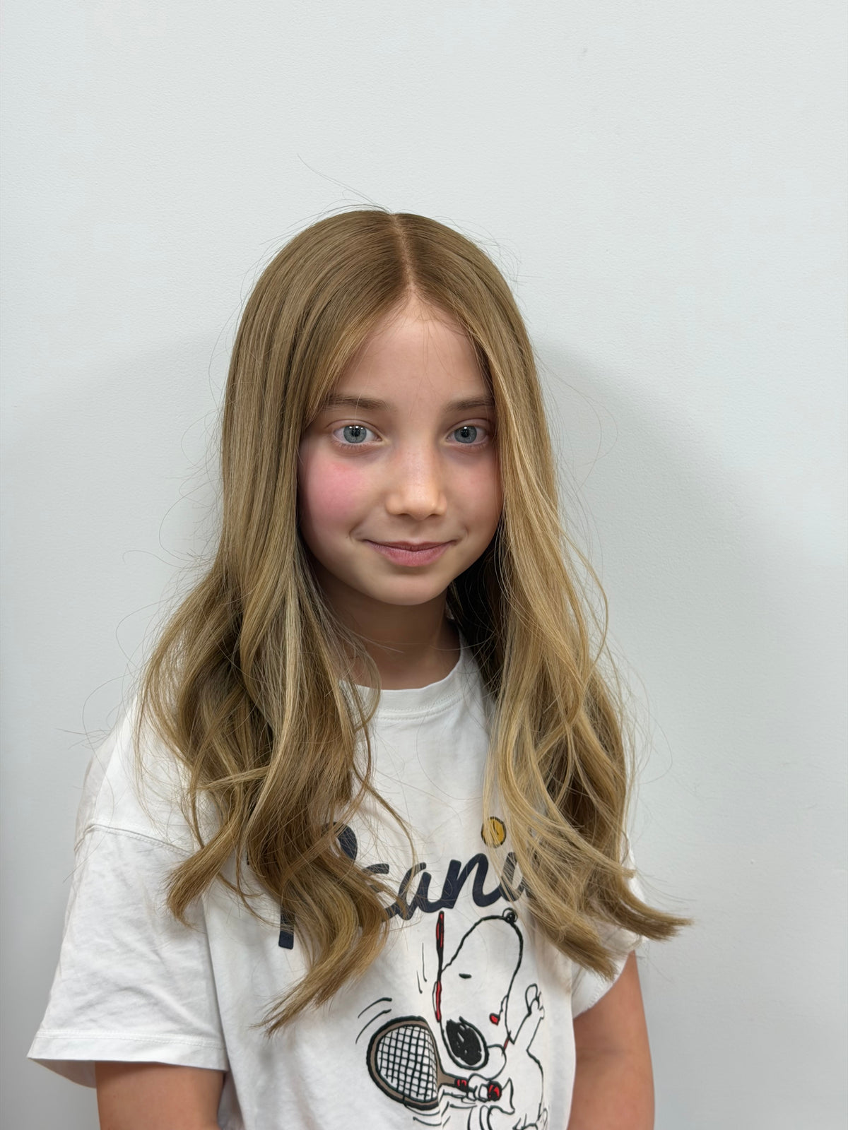 Child wearing the Sasha blonde human hair wig with a natural hairline