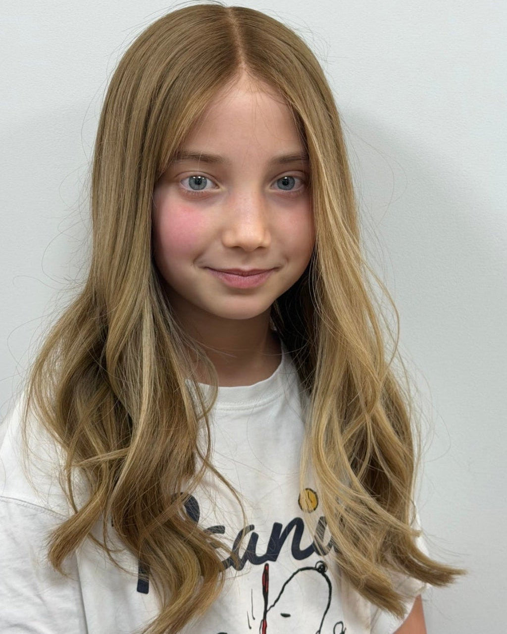 Child wearing the Sasha blonde human hair wig with a natural hairline
