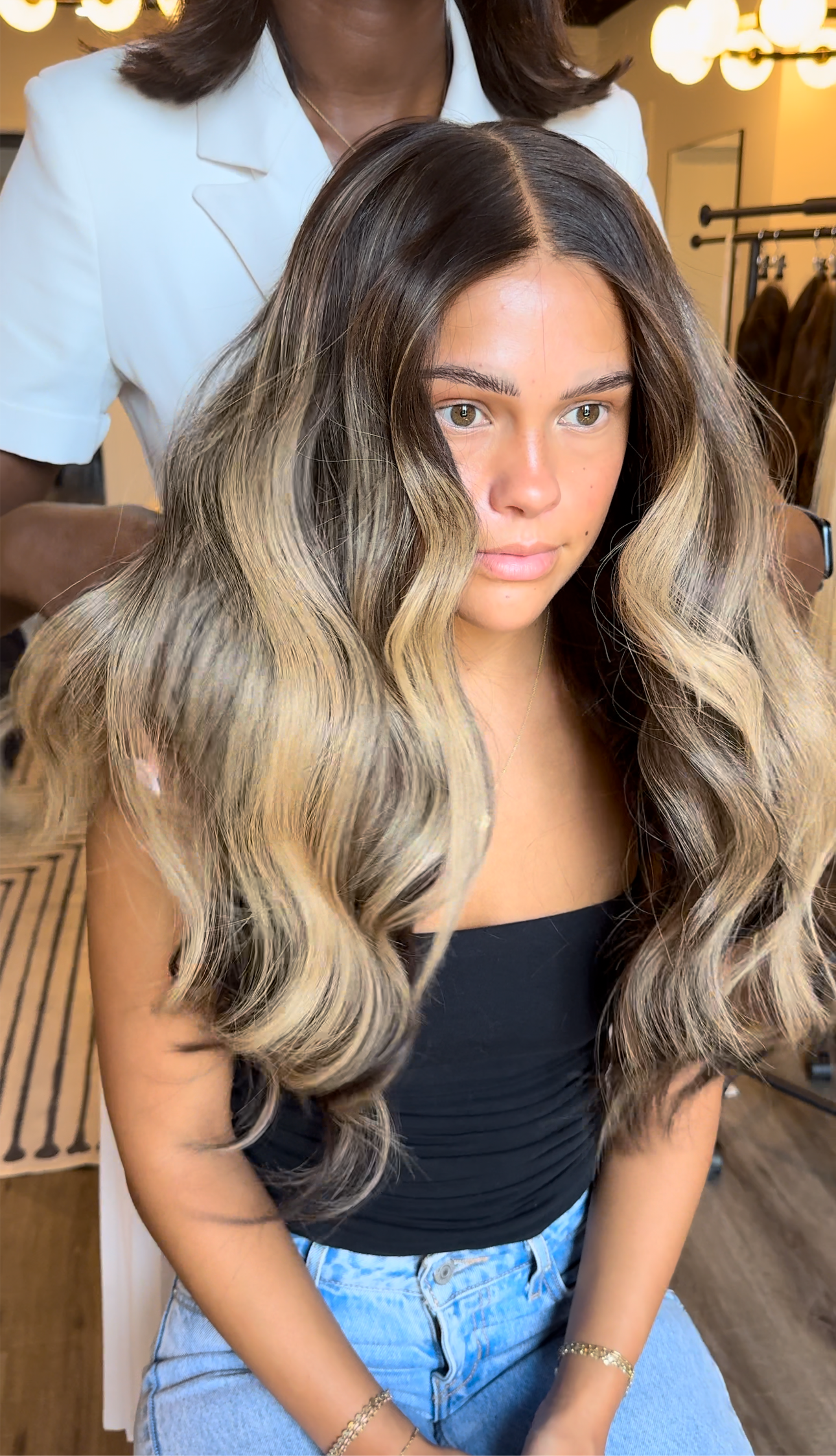 Model wearing brown balayage 26-inch HD lace human hair wig in body wave
texture – Nuola Wigs.
