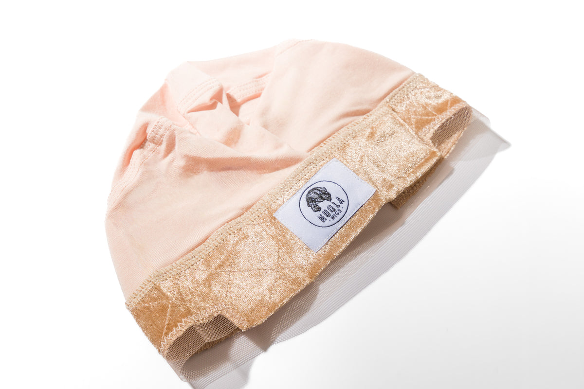 Model wearing beige adjustable non-slip wig grip cap for secure glueless wig hold – Nuola Wigs.